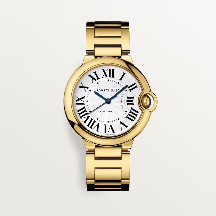Cartier Ballon Bleu women’s luxury watch with full gold stainless steel bracelet, white dial, Roman numeral markers, and blue hands.