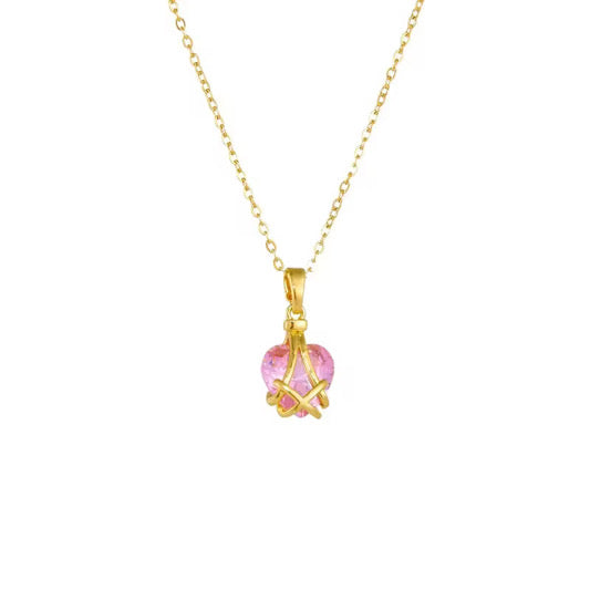 Skai Jewels gold necklace with pink crystal heart pendant in an intricate golden frame.