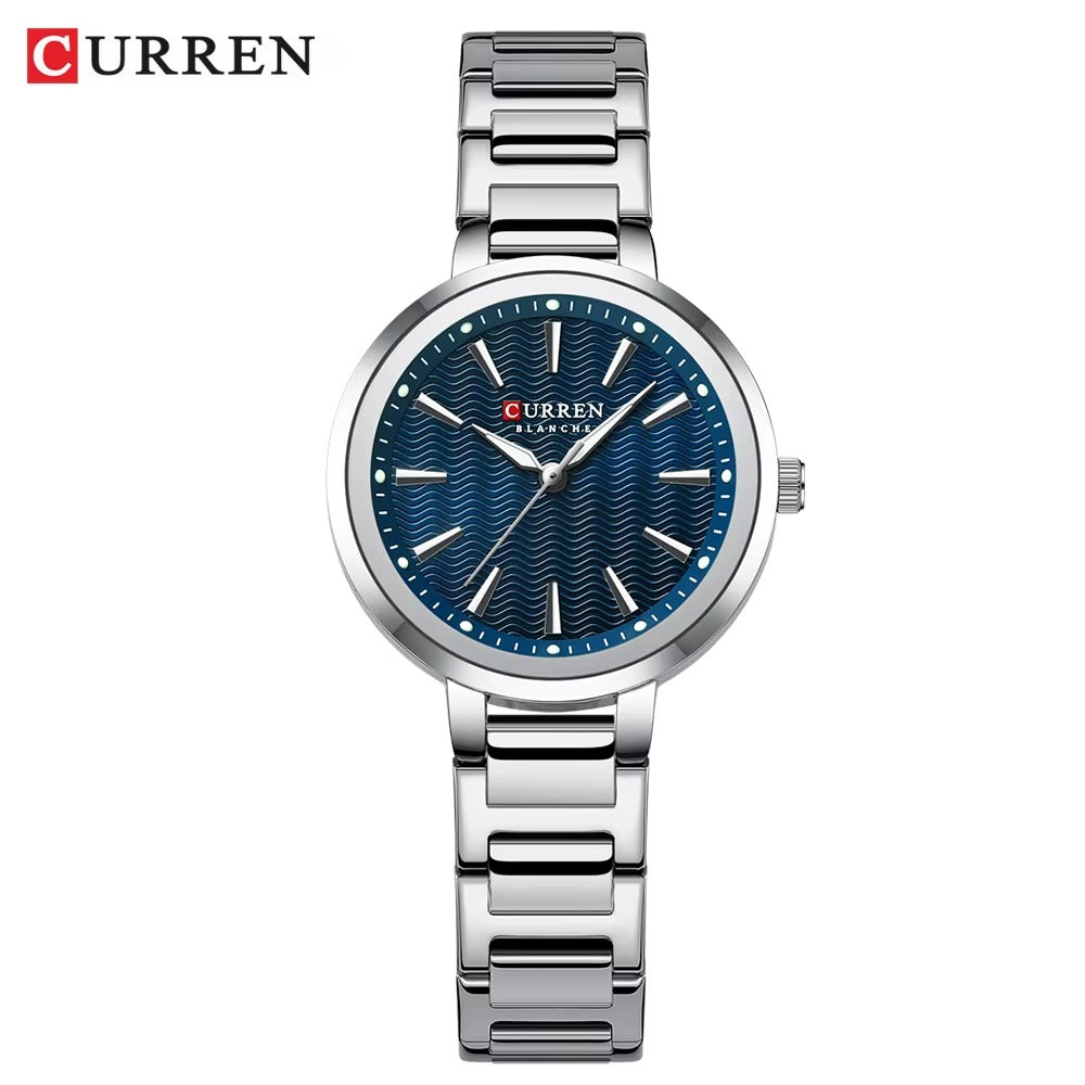 Silver Curren watch with blue dial on a white background